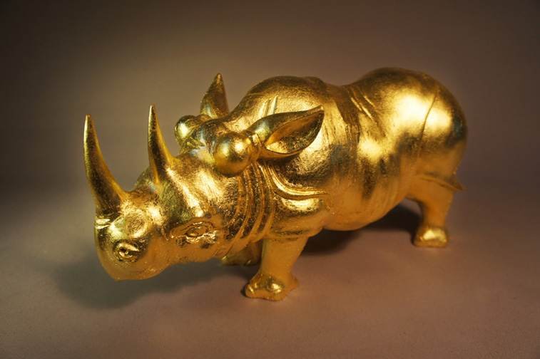 The Golden Rhino — feng shui sculpture gilded in 24K gold leaf